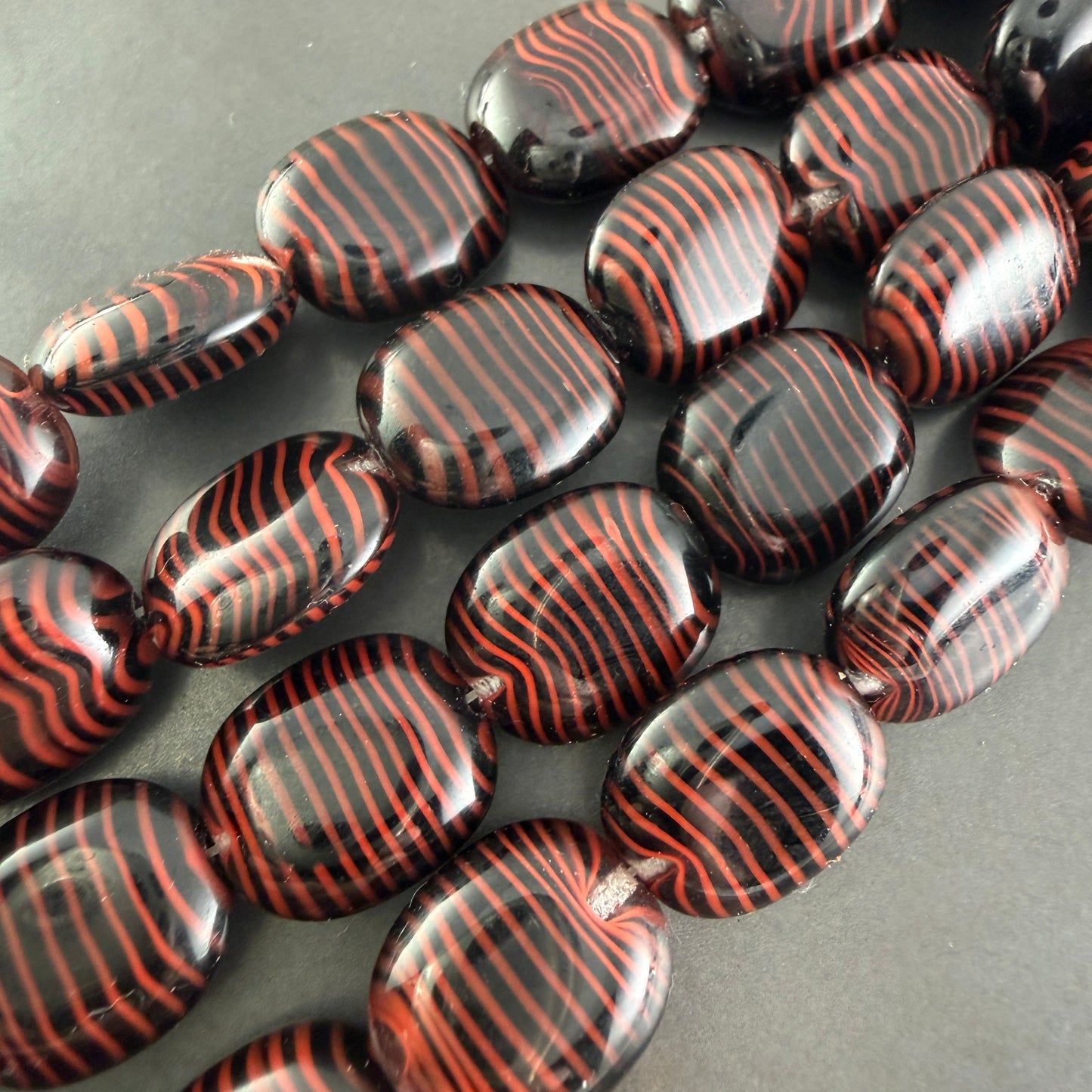 Jet/Red Tiger Stripe Oval, 12mm x 14mm, 14 Beads