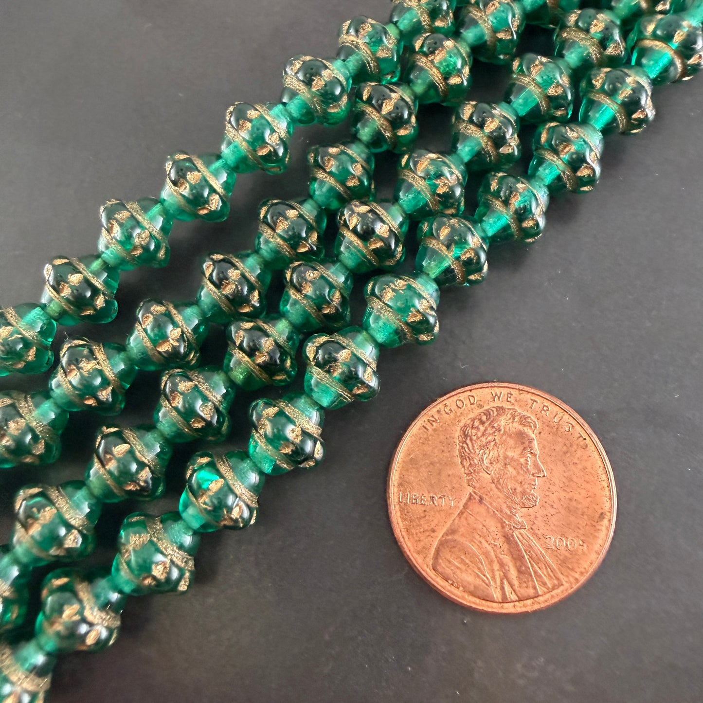 Transparent Emerald and Gold 7mm Spinner Bead