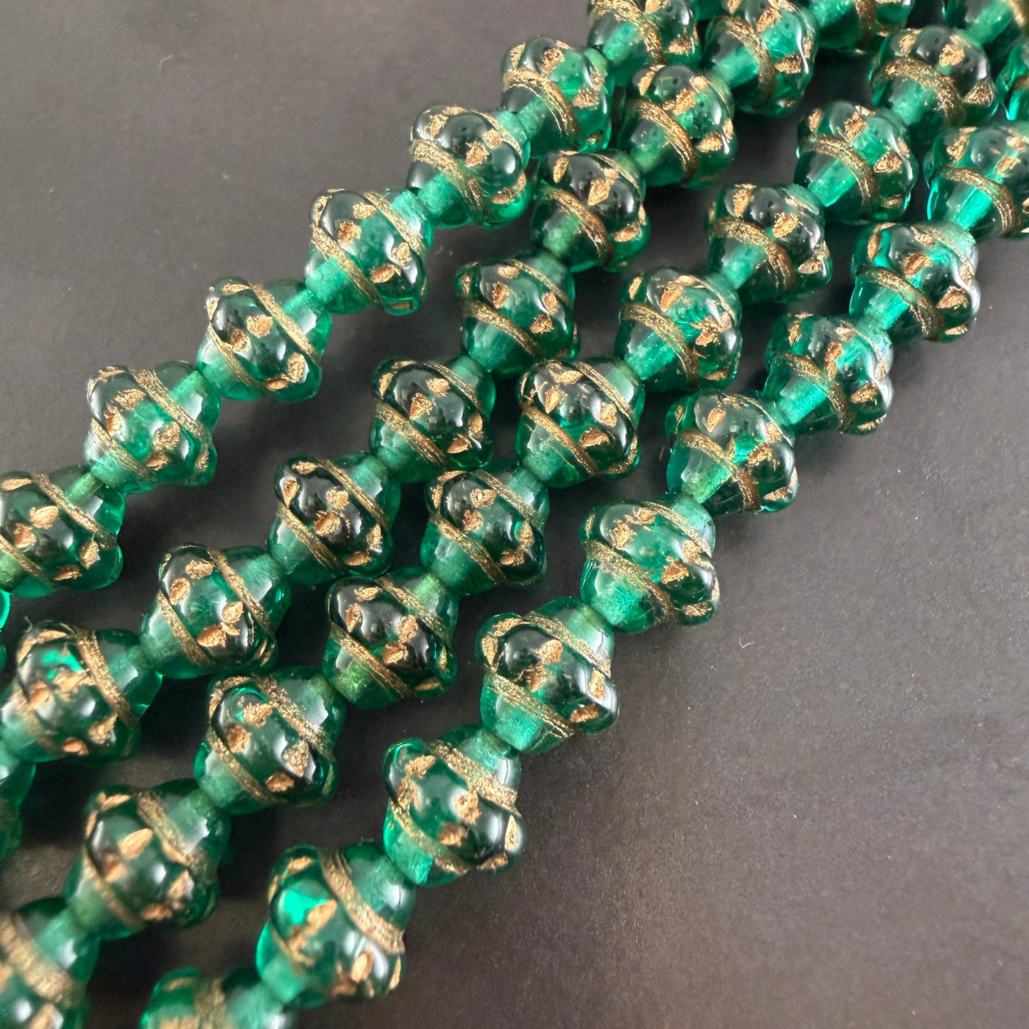 Transparent Emerald and Gold 7mm Spinner Bead