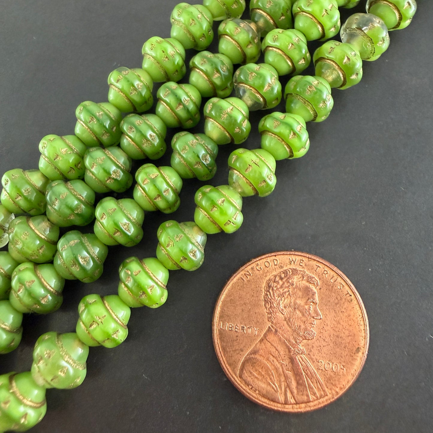 Green and Gold 7mm Spinner Bead