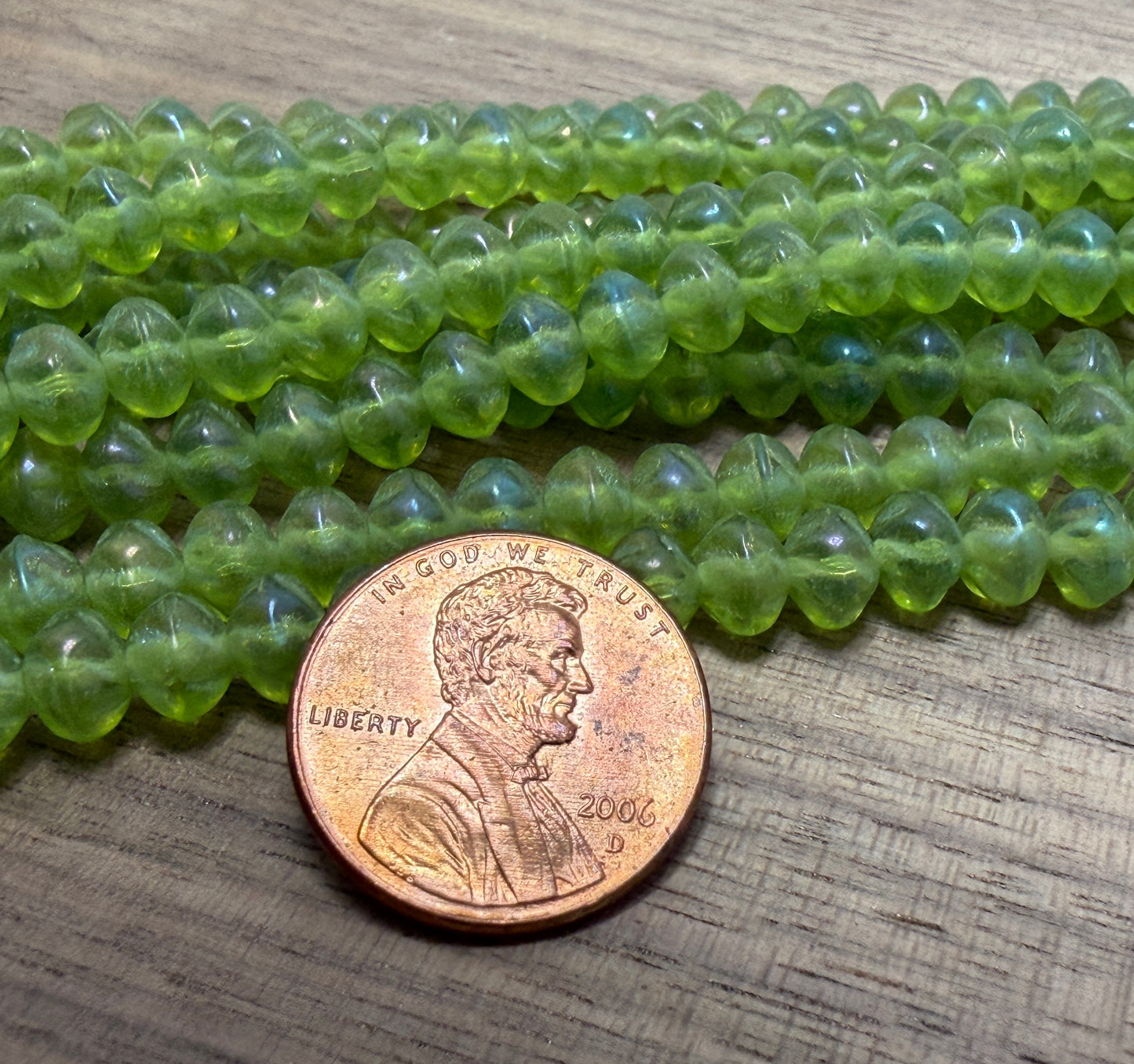 Green Rainbow Iris Rondell. 6mm. 33 beads