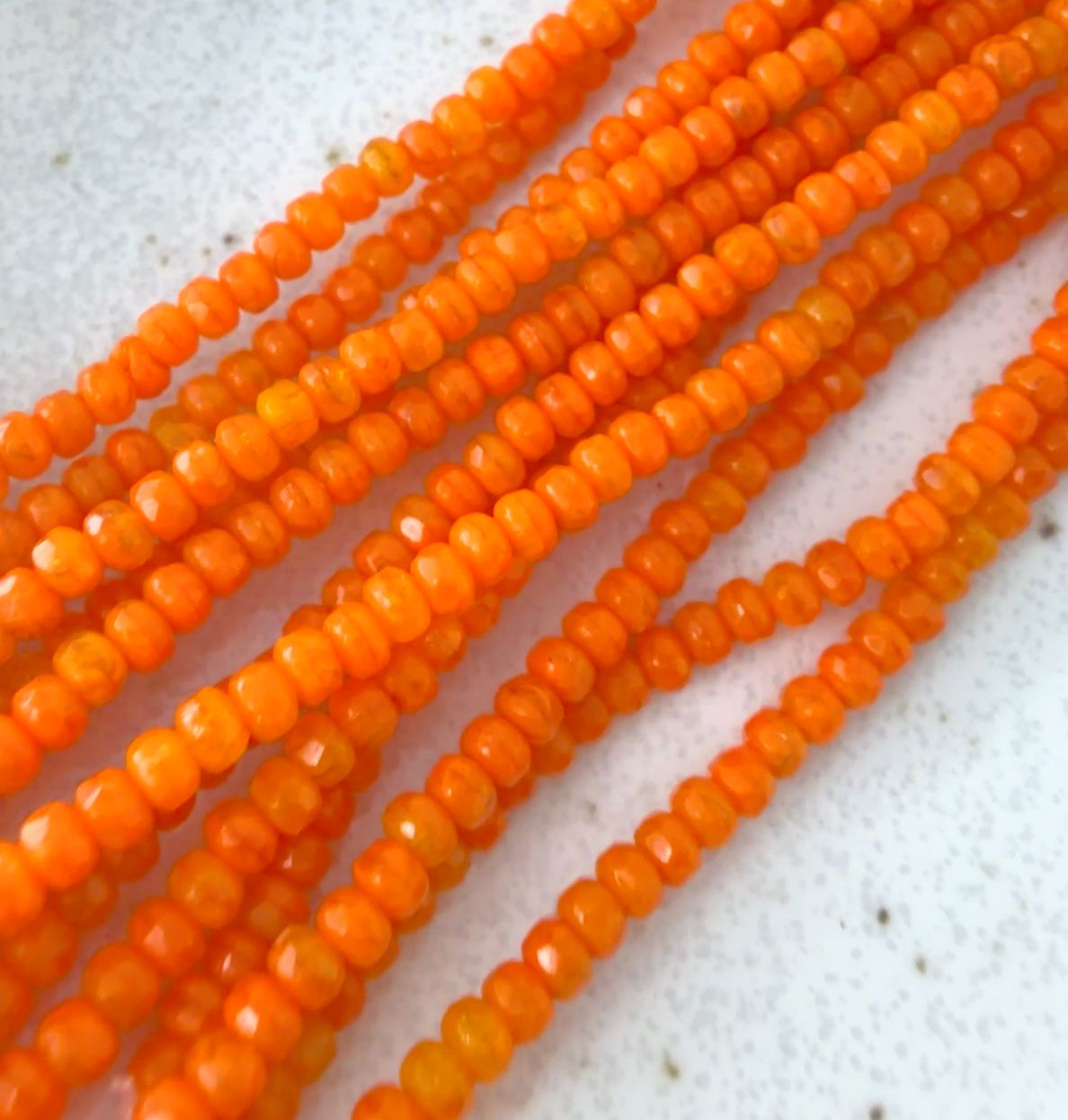 Tiny Orange Faceted Rondell